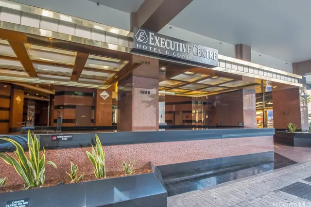 a kitchen with stainless steel appliances granite countertop a stove and cabinets