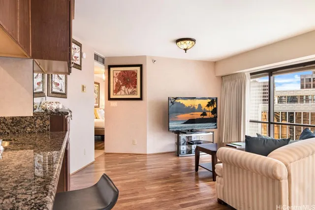 a living room with furniture and a flat screen tv