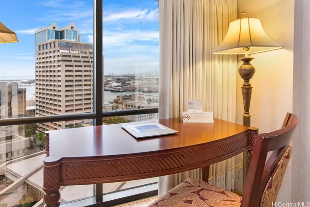 a view of a dining room with furniture and a window