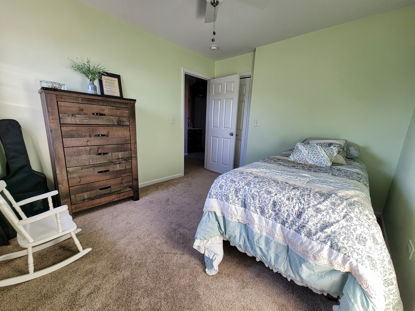 292 South Will Road Diamond, IL 60416 - Photo 14 of 19 a bedroom with a bed and a chair