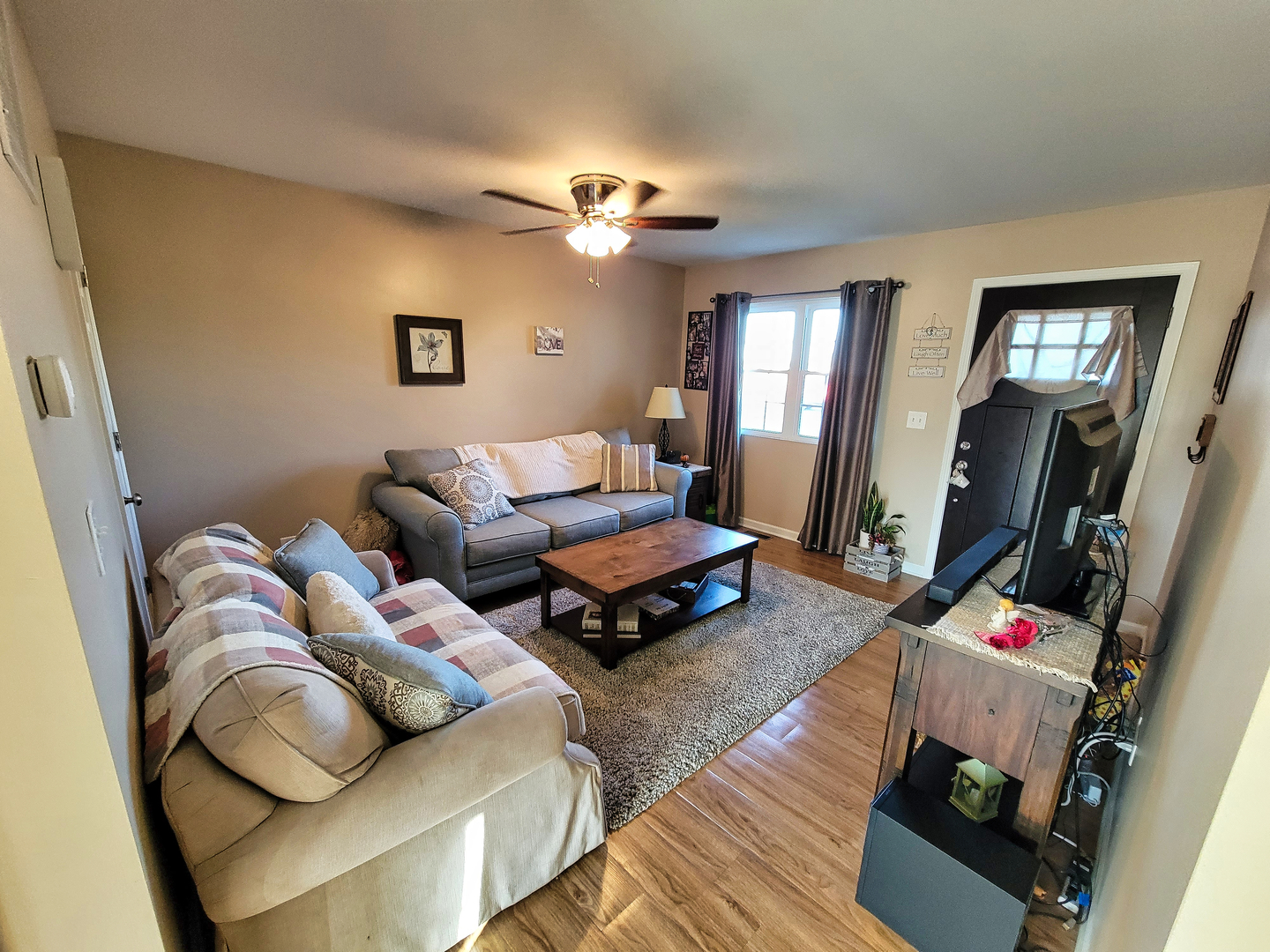 292 South Will Road Diamond, IL 60416 - Photo 4 of 19 a living room with furniture and a flat screen tv