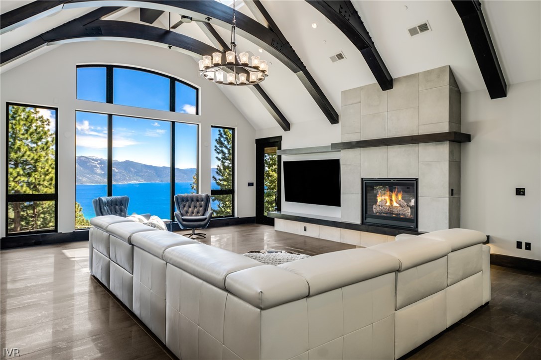 a living room with furniture fireplace and flat screen tv