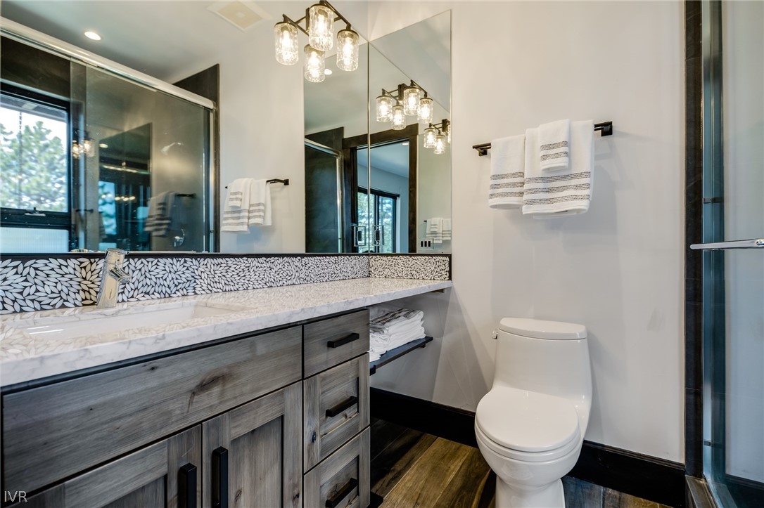 567 Alden Lane Incline Village, NV 89451 - Photo 24 of 35 a bathroom with a granite countertop toilet sink and mirror