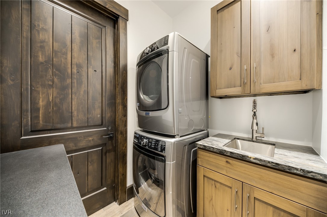 567 Alden Lane Incline Village, NV 89451 - Photo 32 of 35 a utility room with granite countertop a sink and a washer dryer