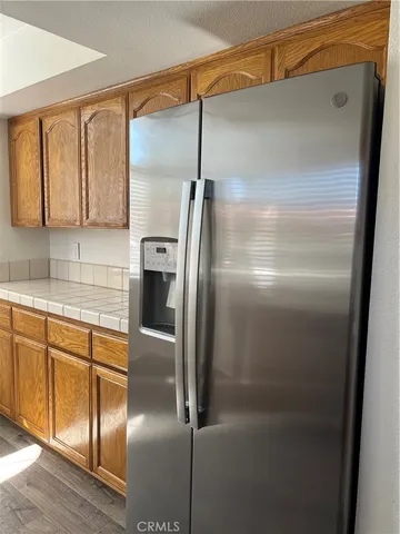 a kitchen with metallic refrigerator freezer and a dishwasher