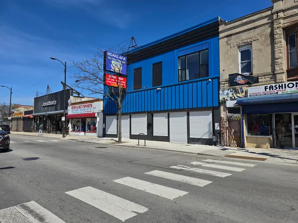 a view of a building with a street