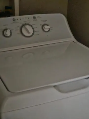 a utility room with a washing machine
