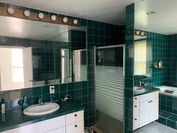 a bathroom with a sink a vanity and a mirror