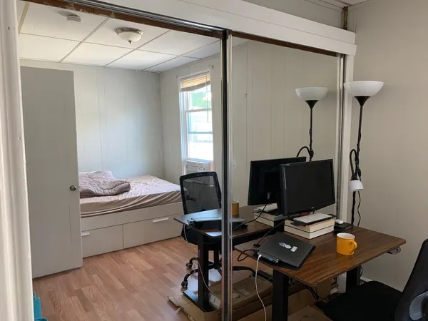 a workspace with furniture and wooden floor