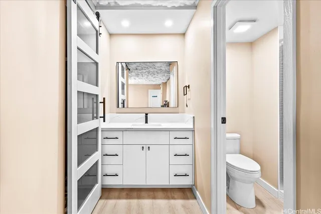 a bedroom with a bed and a night stand