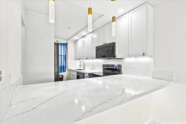 a kitchen with a stove and a microwave