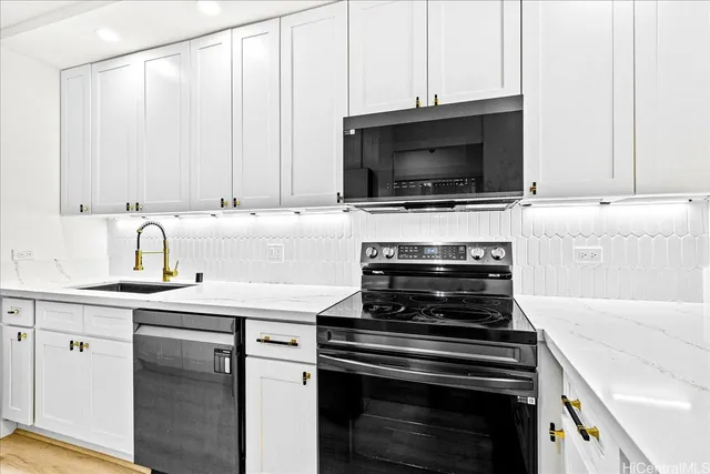 a kitchen with stainless steel appliances a refrigerator sink and cabinets