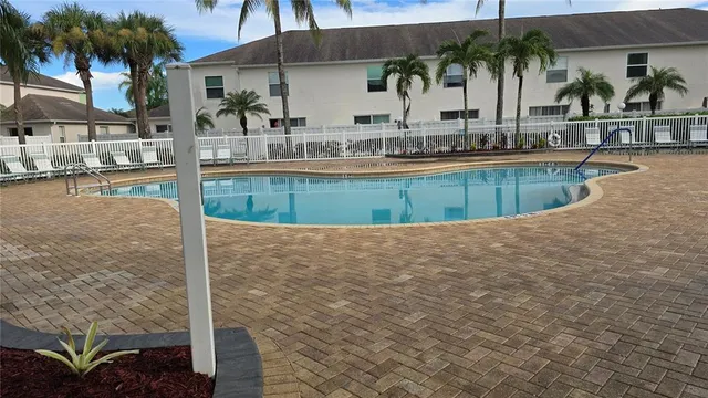 a view of a swimming pool with a patio