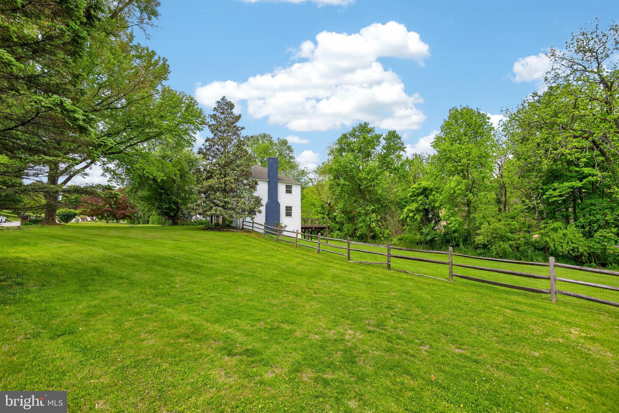 700 Campwoods Road Villanova, PA 19085 - Photo 71 of 77 a view of a golf course with a lake