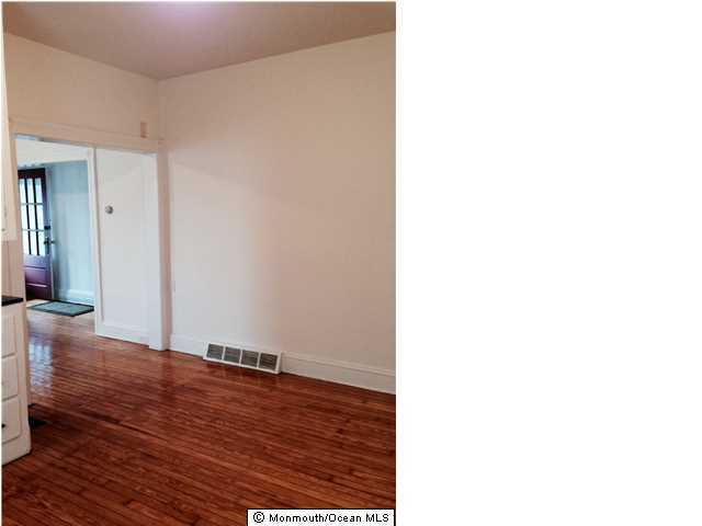 42 Washington Street Red Bank, NJ 07701 - Photo 2 of 6 a view of hallway with wooden floor