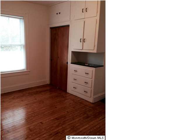 42 Washington Street Red Bank, NJ 07701 - Photo 3 of 6 a view of a kitchen with wooden floor