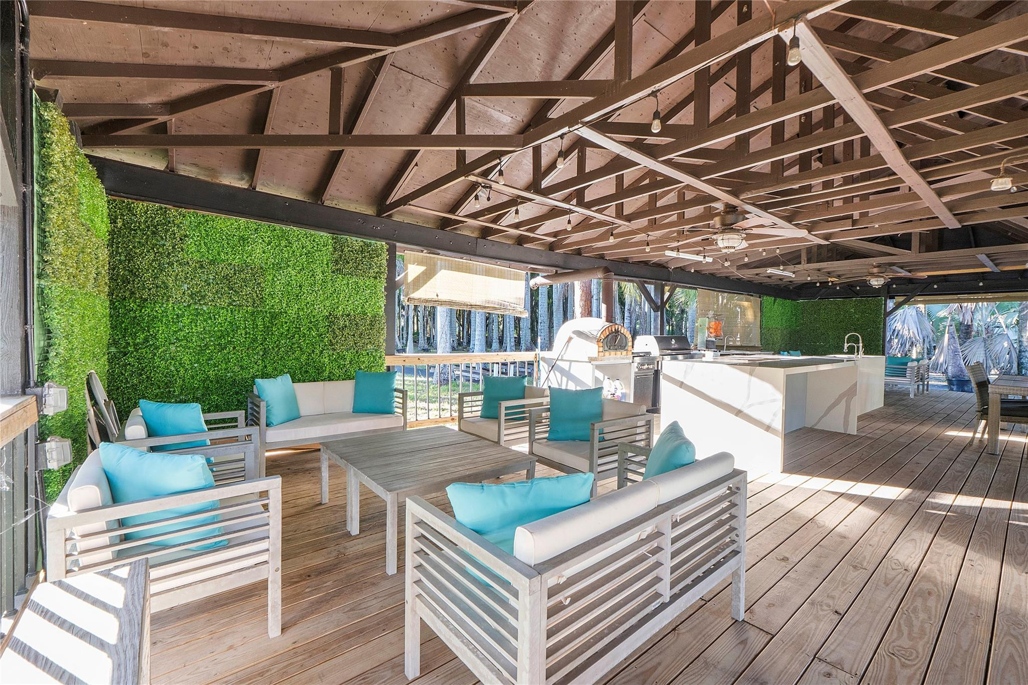 5351 Godfrey Road Parkland, FL 33067 - Photo 84 of 95 a view of a patio with couches and chairs with wooden floor