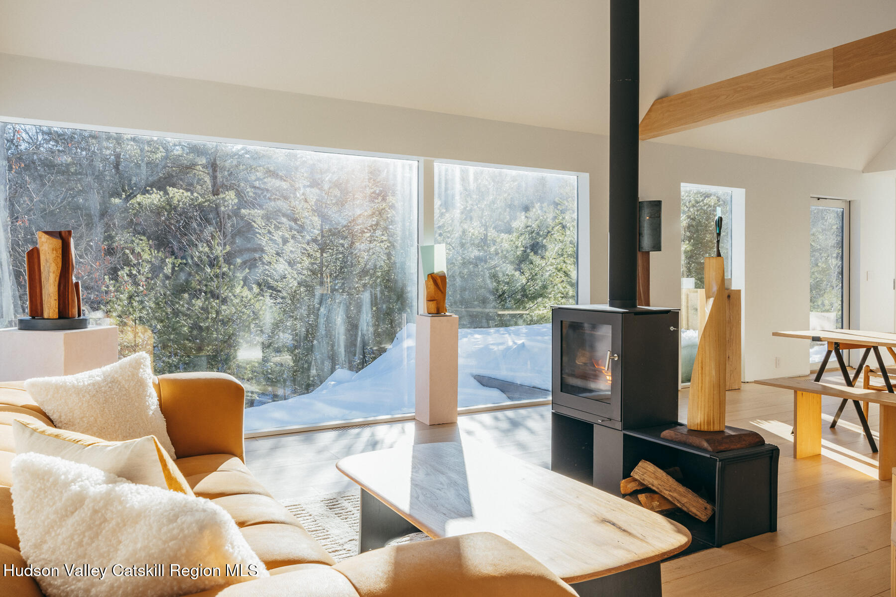 261 Blackhead Mountain Road Round Top, NY 12473 - Photo 11 of 40 a living room with furniture and a floor to ceiling window