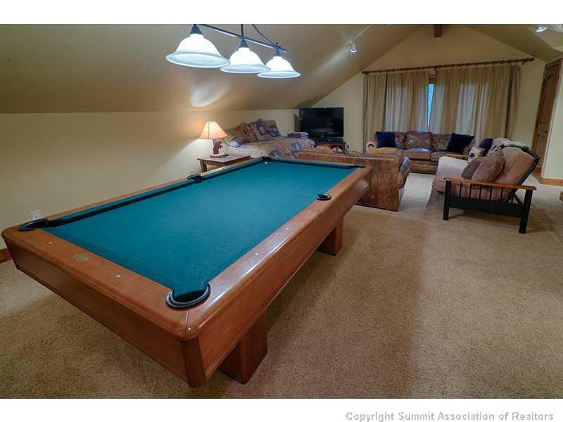 1005 4 O Clock Road Breckenridge, CO 80424 - Photo 12 of 24 a room with furniture pool table and a chandelier