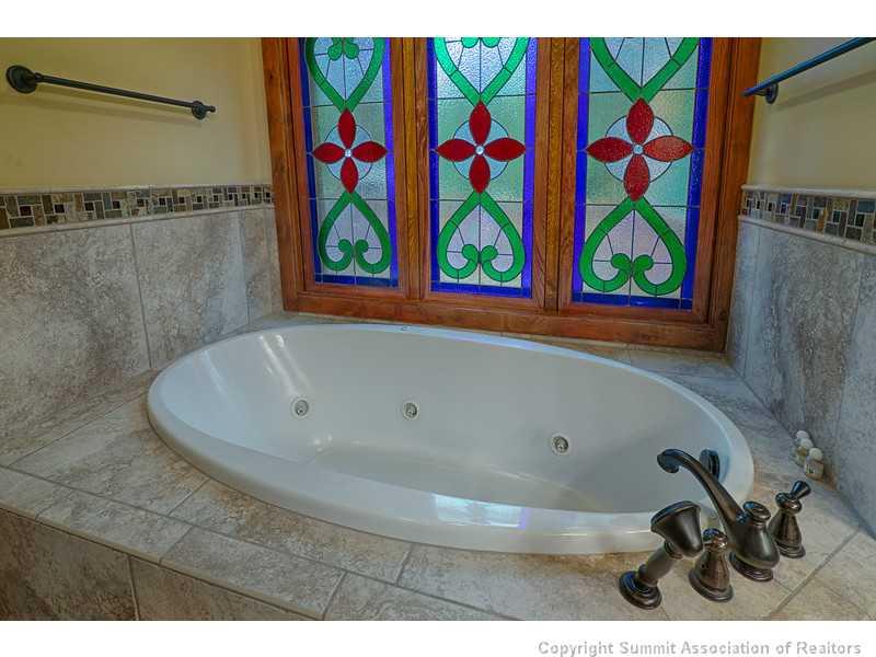 1005 4 O Clock Road Breckenridge, CO 80424 - Photo 15 of 24 a bathroom with a bathtub and a shower curtain