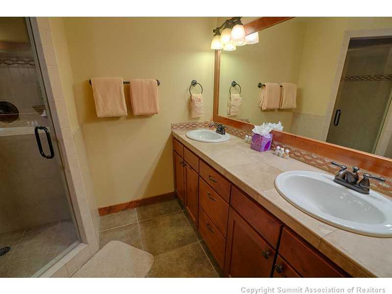1005 4 O Clock Road Breckenridge, CO 80424 - Photo 17 of 24 a bathroom with a sink a mirror and vanity
