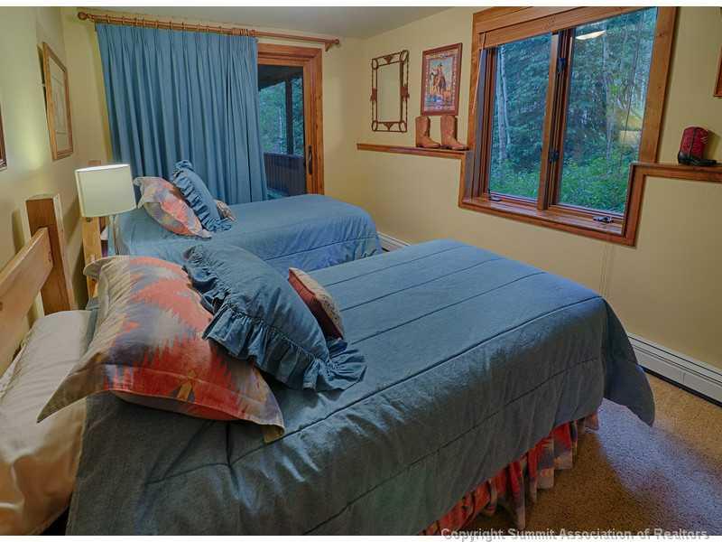 1005 4 O Clock Road Breckenridge, CO 80424 - Photo 18 of 24 a bed sitting in a bedroom next to a window