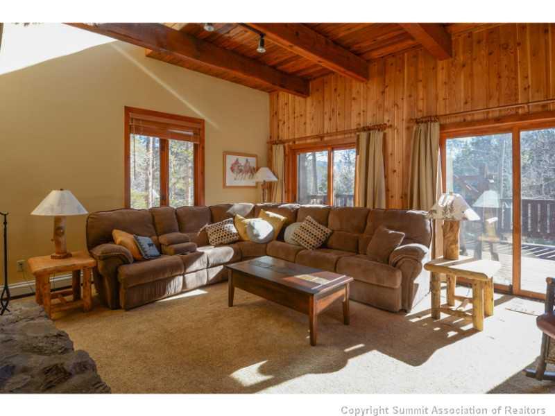 1005 4 O Clock Road Breckenridge, CO 80424 - Photo 6 of 24 a living room with furniture a window and a fireplace