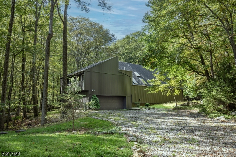 12 Big Spring Road Califon, NJ 07830 - Photo 2 of 33 a view of a wooden house with a small yard