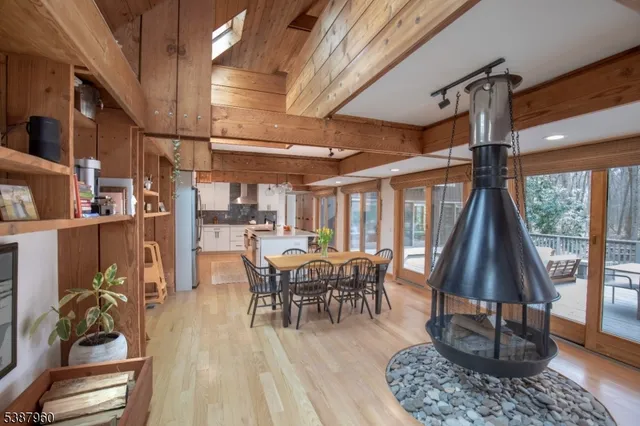 a dining room with furniture window and wooden floor