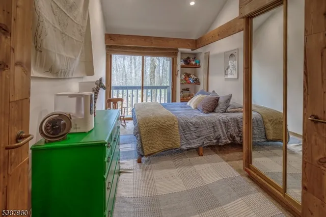 a bedroom with a bed and windows