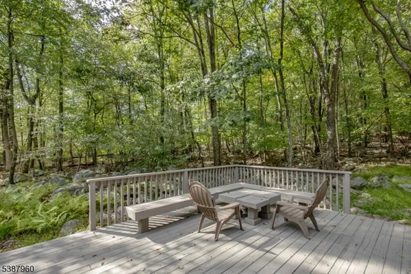 a view of a chair and table on the wooden floor