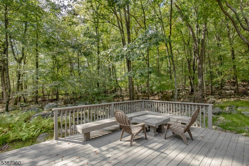12 Big Spring Road Califon, NJ 07830 - Photo 8 of 33 a view of a chair and table on the wooden floor