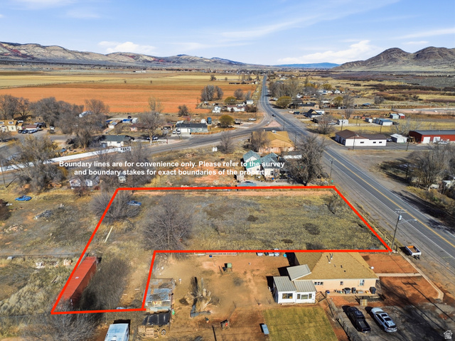 66 South State Street Sigurd, UT 84657 - Photo 2 of 13 Aerial overview of property's location with a mountain backdrop and property parcel outlined