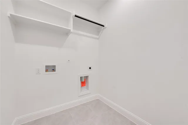 a sign that is sitting on the grass next to a road