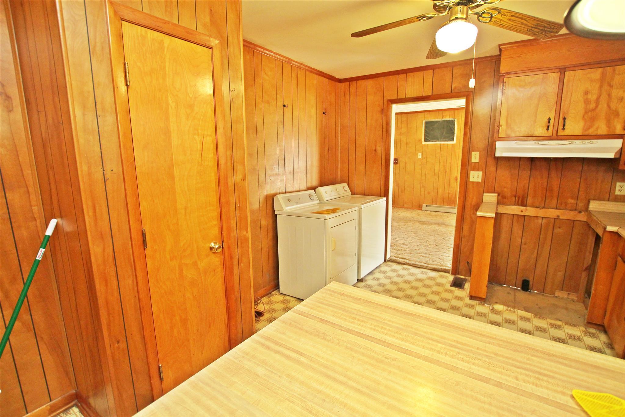 3912 Robert Pryor Road Springfield, TN 37172 - Photo 9 of 28 a bedroom with a bed and a chandelier