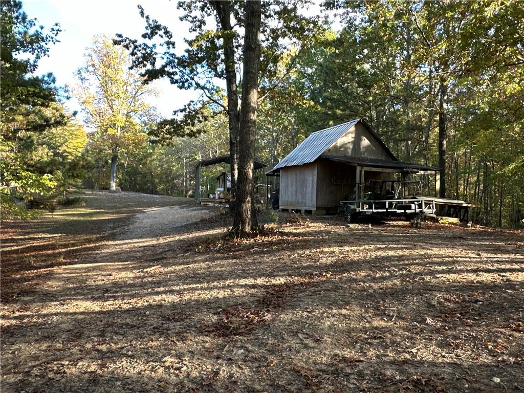 1806 Browning Road Rockmart, GA 30153 - Photo 45 of 89 a front view of a house with a garden