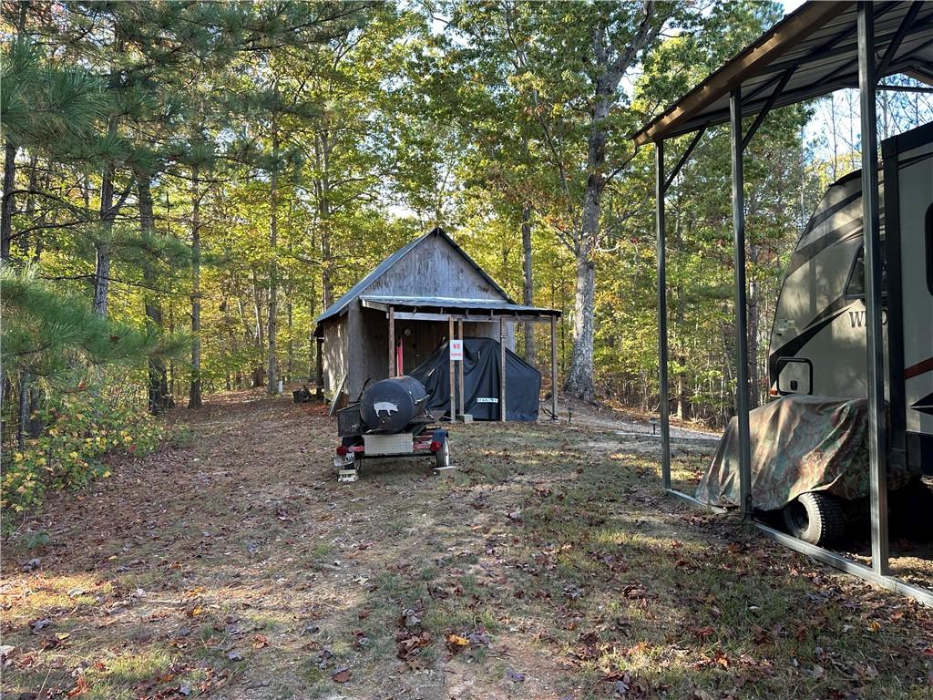 1806 Browning Road Rockmart, GA 30153 - Photo 52 of 89 a view of a house with a yard and sitting area