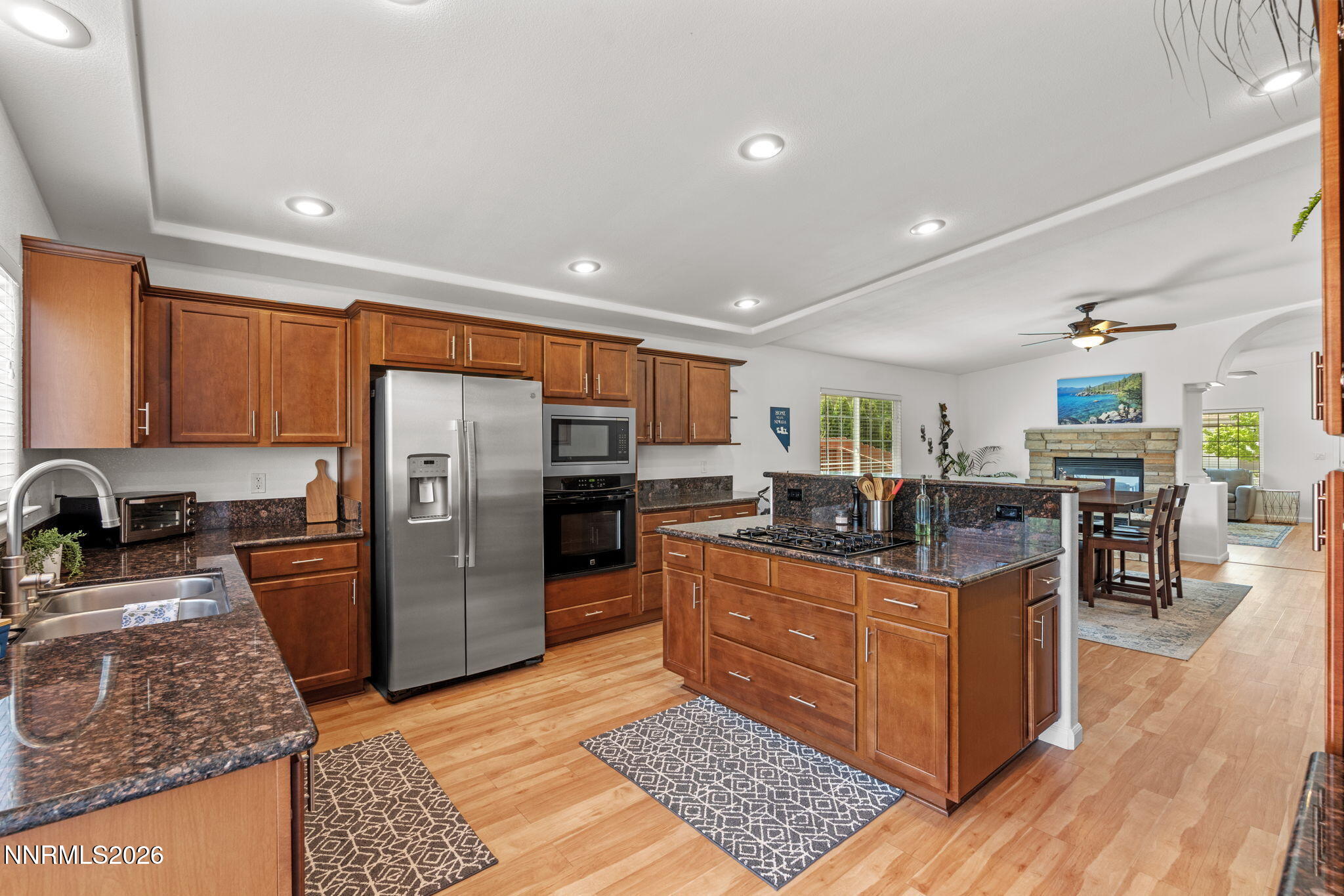 18324 Panda Bear Court Reno, NV 89508 - Photo 8 of 44 a kitchen with stainless steel appliances granite countertop a refrigerator and a stove