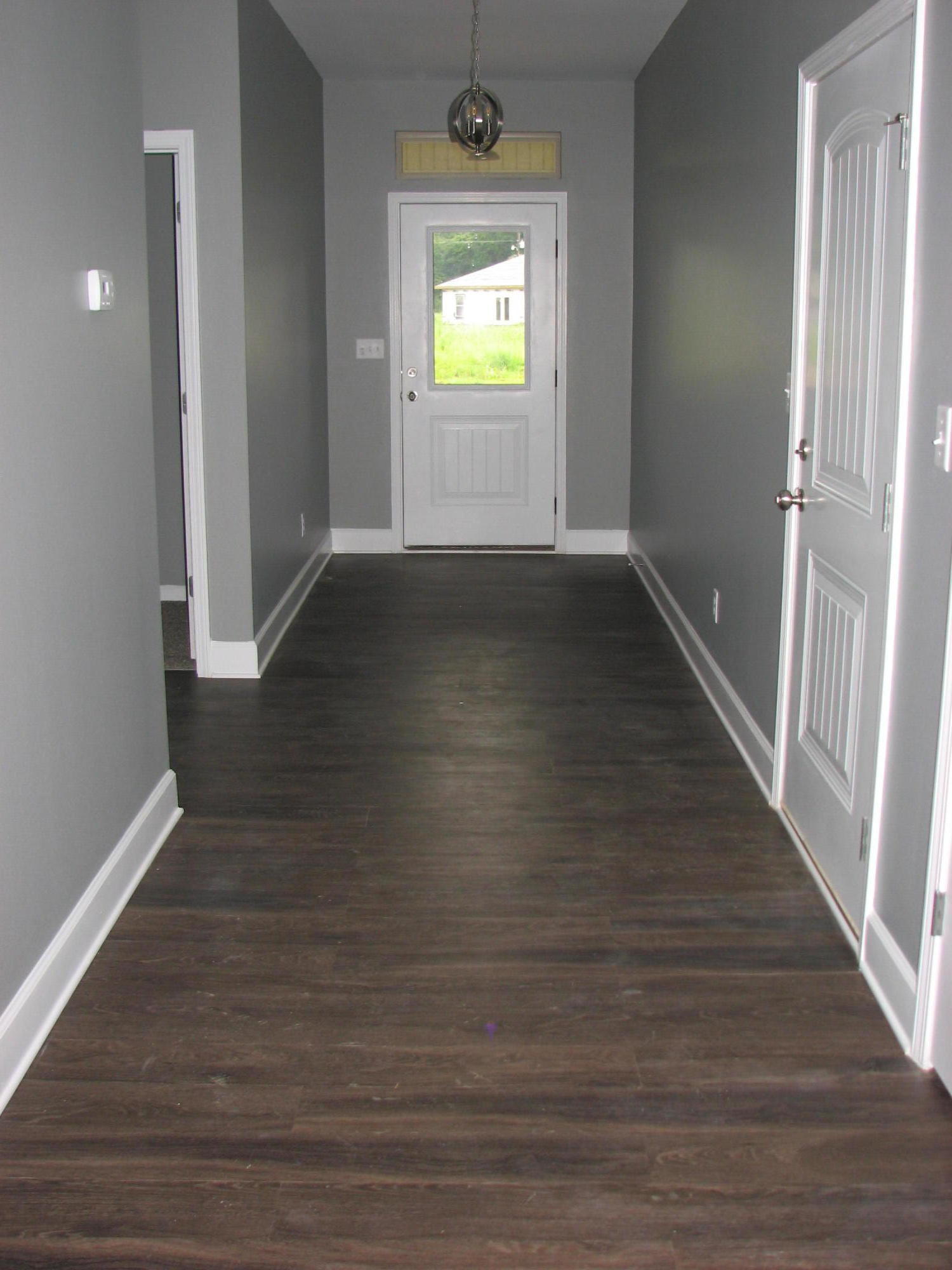 5652 Price Plantation Road Baker, FL 32531 - Photo 8 of 11 a view of room with wooden floor