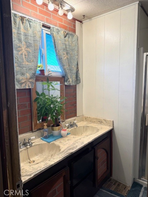 16601 Garfield Avenue, Unit 110 Paramount, CA 90723 - Photo 14 of 22 a bathroom with a sink and a mirror