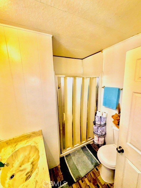 16601 Garfield Avenue, Unit 110 Paramount, CA 90723 - Photo 16 of 22 a bathroom with a sink toilet and shower