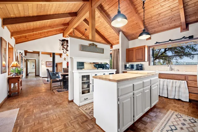 a kitchen with a stove and a refrigerator
