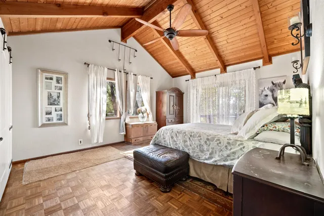 a bathroom with a double vanity sink mirror and a bathtub
