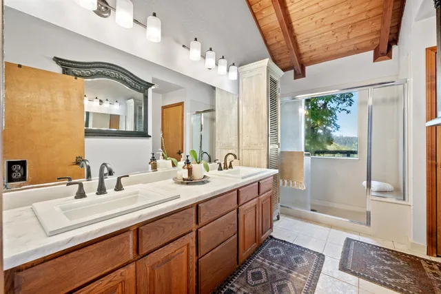 a room with furniture a dining table and a flat screen tv