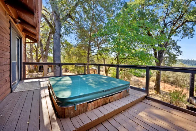 a balcony with view of outdoor space