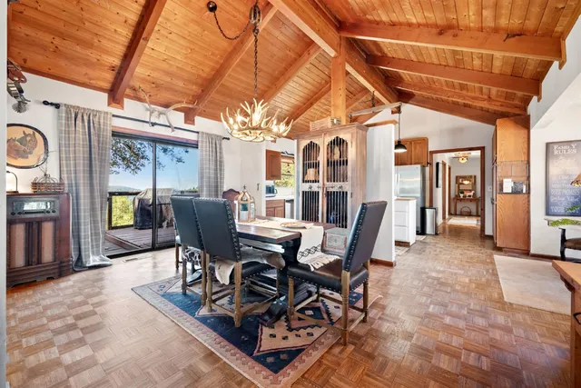 a kitchen with stainless steel appliances granite countertop a refrigerator a stove and a wooden cabinets