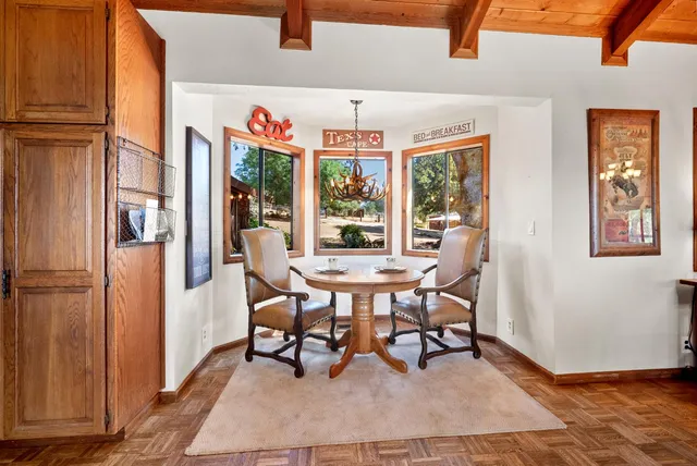 a kitchen with refrigerator cabinets and wooden floor