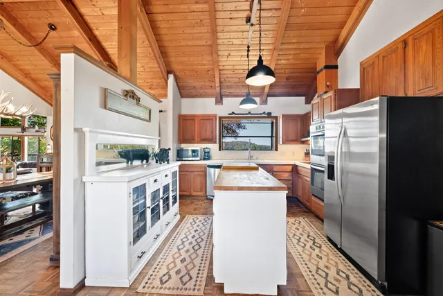 a view of a kitchen with furniture and a stove