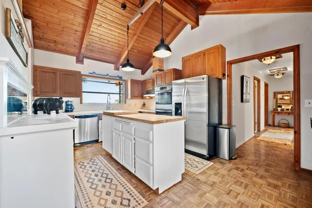 a kitchen with stainless steel appliances granite countertop a sink and cabinets