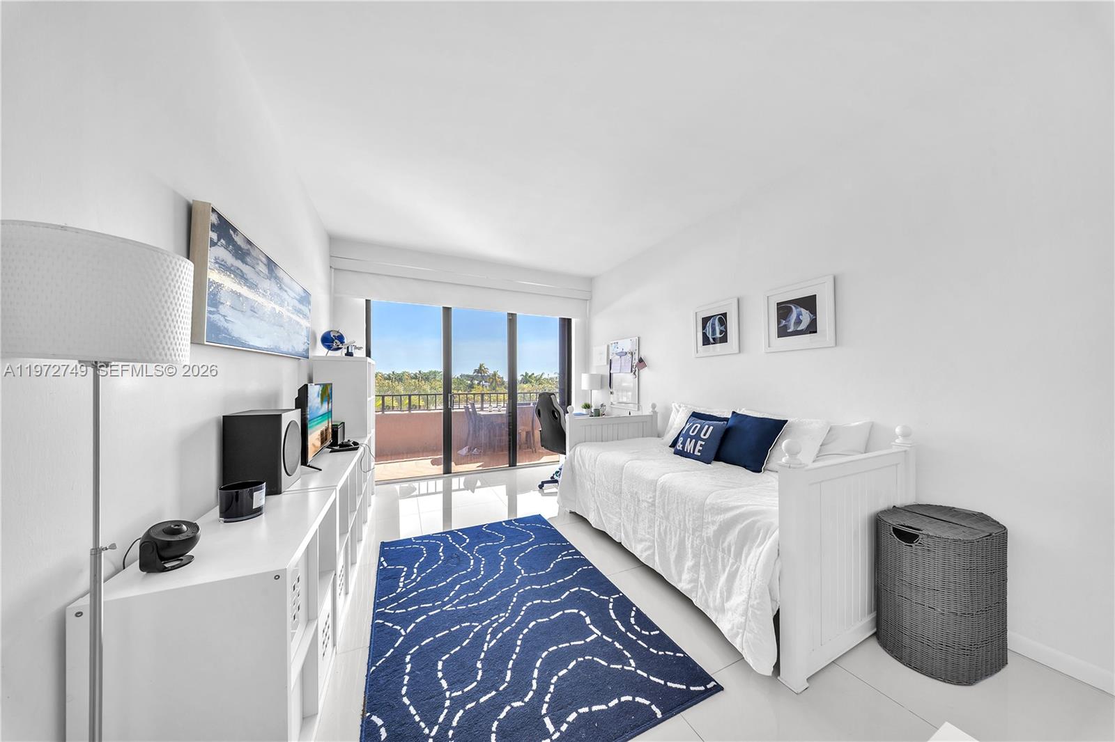 Key Colony Condominiums Key Biscayne, FL 33149 - Photo 12 of 20 a bedroom with a bed and a flat screen tv
